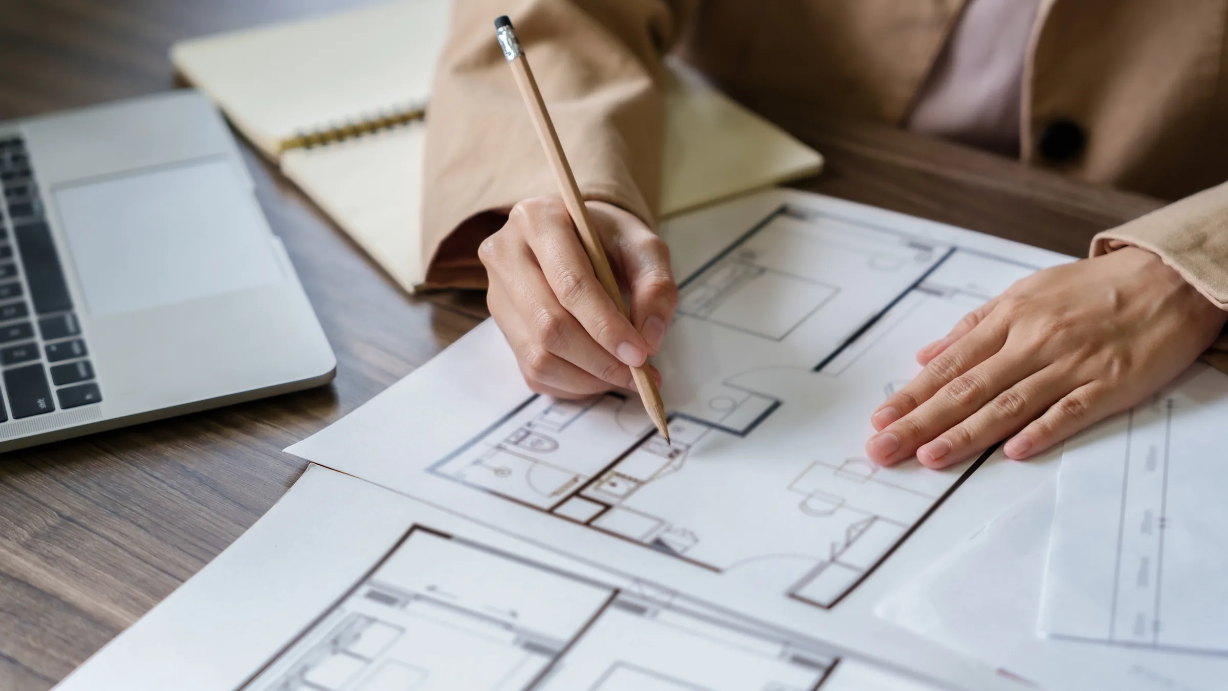 Designer drawing a kitchen floor plan by hand